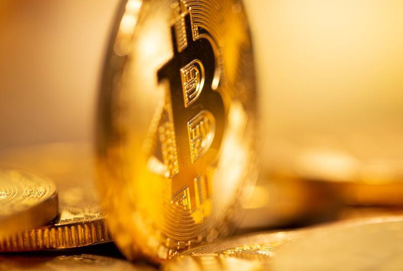 比特币价格达创纪录5.8万美元 今年已上涨100%